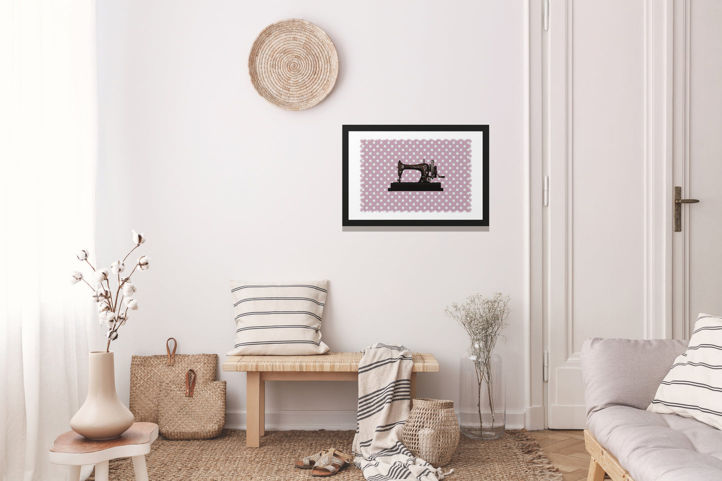 A picture of a sewing machine on an antique pink background with a black frame. Suitable for retro and vintage lovers. Suitable for a room with a white rustic design