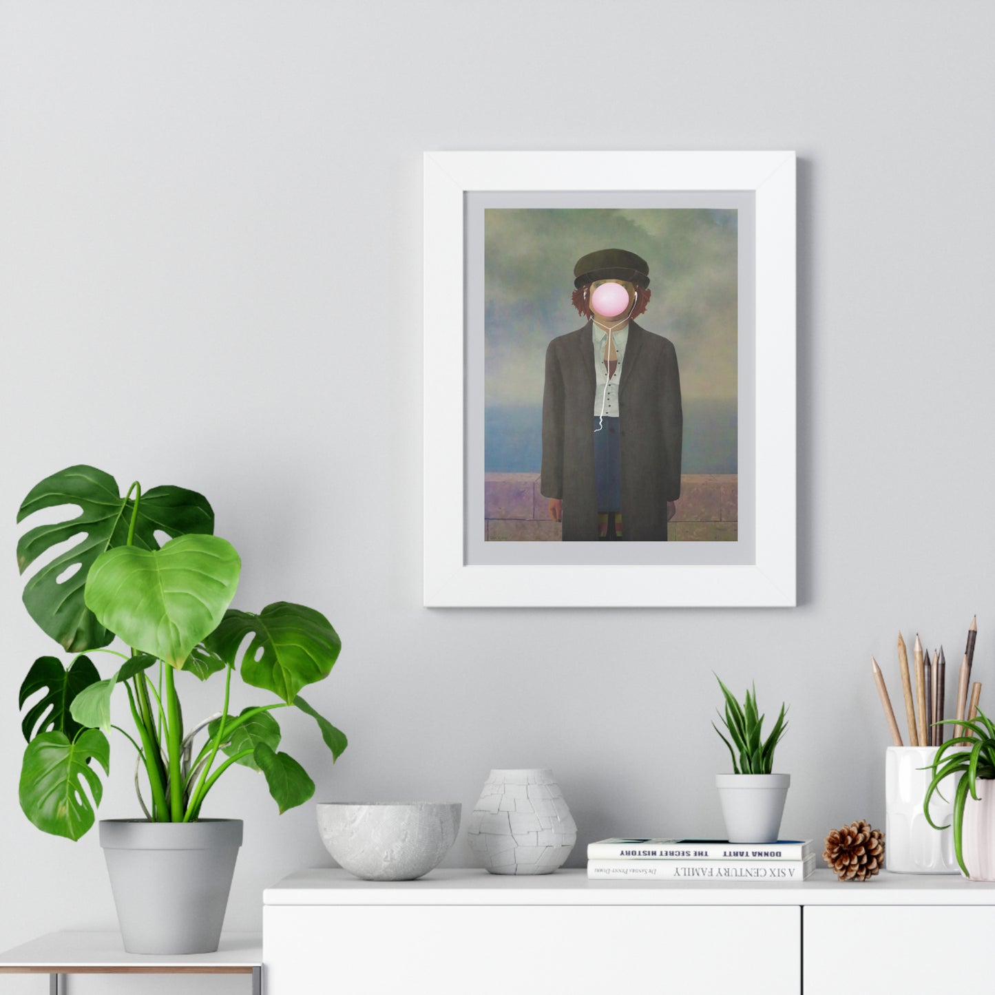 Elevate your space with this modern poster inspired by René Magritte's iconic Son of Man. This youthful interpretation brings a touch of humor and sophistication, perfect for adding personality to any room. Whether it's displayed in your living area, office, or a cozy nook, it seamlessly complements white furniture while infusing life and charm into your decor. Enhance your home with this unique artwork that sparks conversation and showcases your appreciation for classic art with a contemporary twist. 