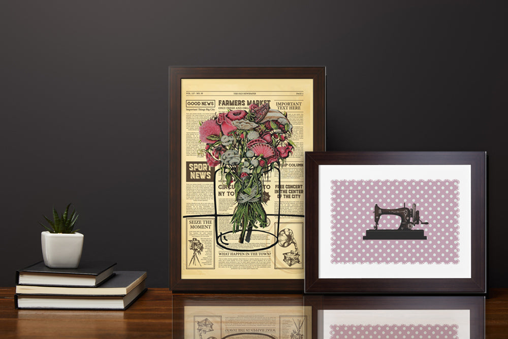 A picture of a sewing machine on an antique pink background with a black frame. The picture is suitable for a complementary picture next to other pictures on a shelf or on a wall decorated with small pictures