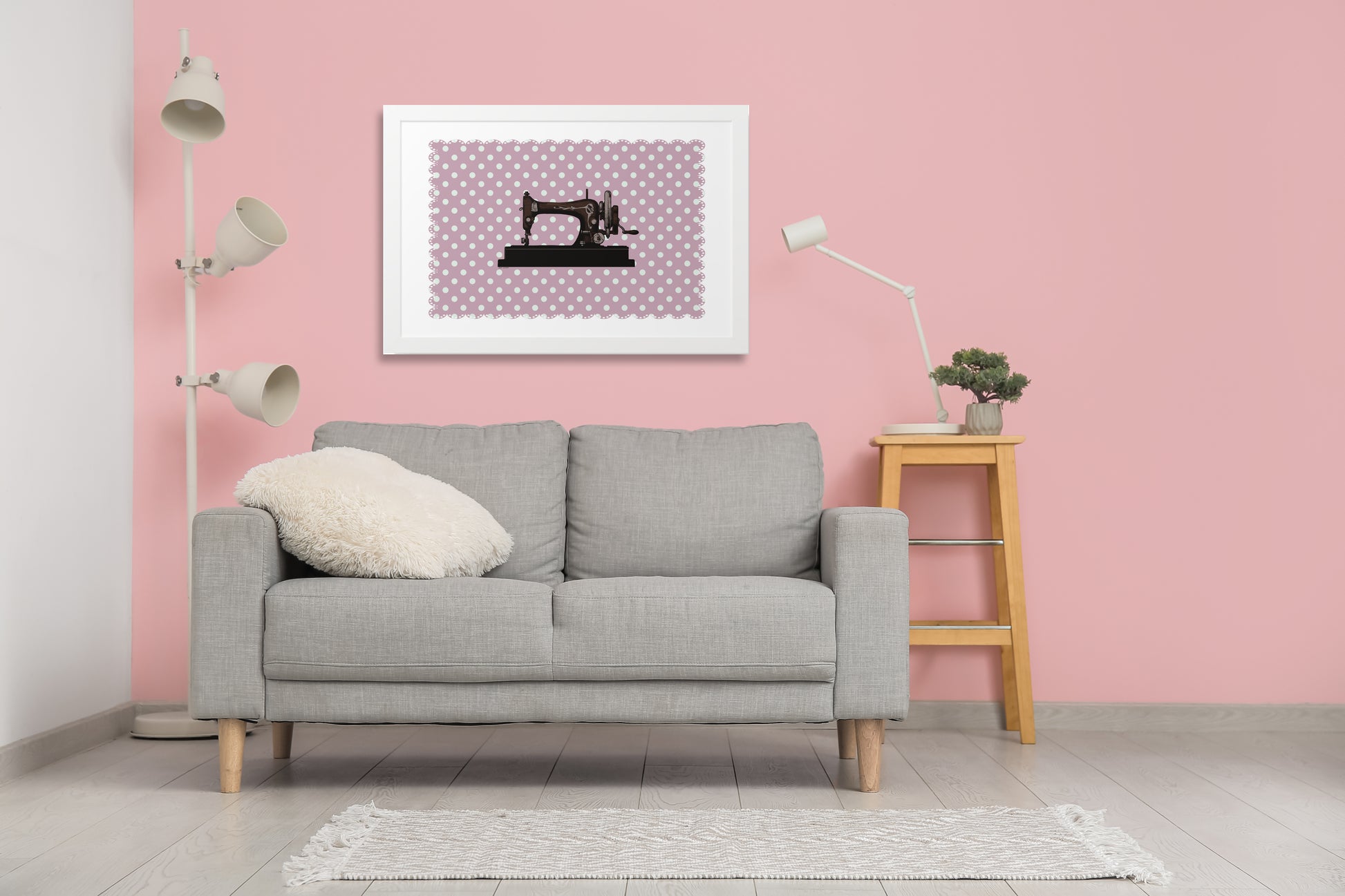 A framed picture of a sewing machine on an antique pink background. Vintage style is suitable for an apartment with a feminine design. A sweet painting that fits any room. Gives the room a granny look.