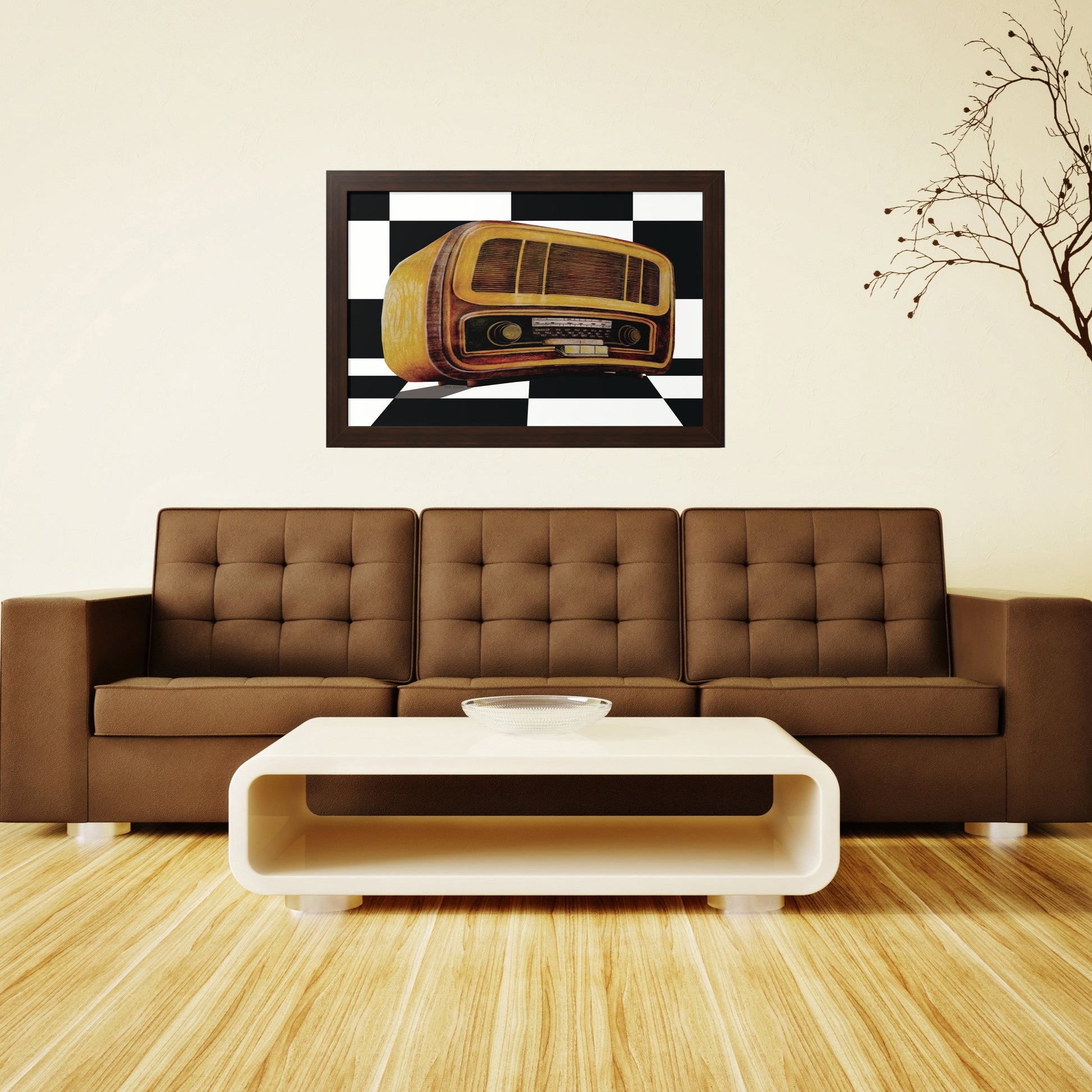 An impressive drawing of an antique radio in the style of the 1970s     
 A walnut frame above a brown leather sofa in the living room with natural wood parquet, with an oval white living room table