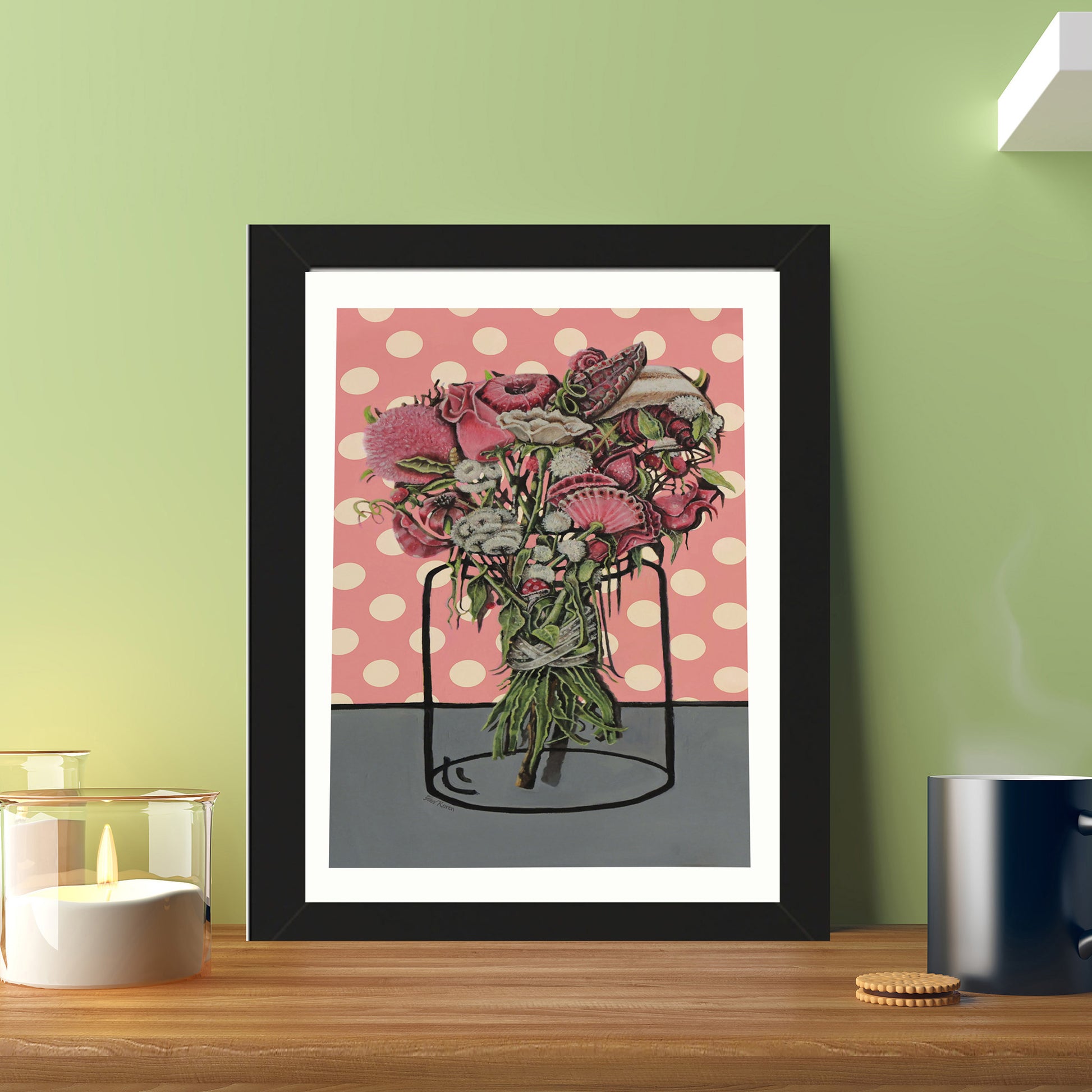 An oil painting with a black frame of a bouquet of flowers tied with a silk ribbon placed on pink gift paper with dots with a jar illustrated on the paper. The image is suitable for any space. Also for a coffee corner in the workplace. Everywhere the painting will add beauty